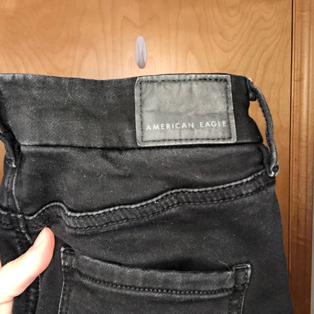 American Eagle black ripped Next-Stretch skinny jeans, size 0